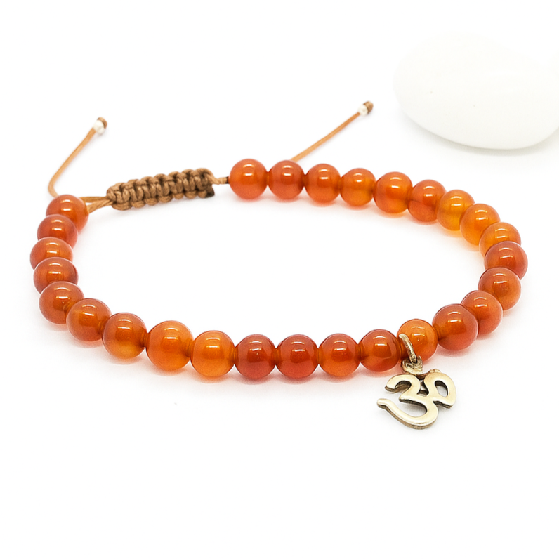 Orange beaded bracelet with a silver Om charm 